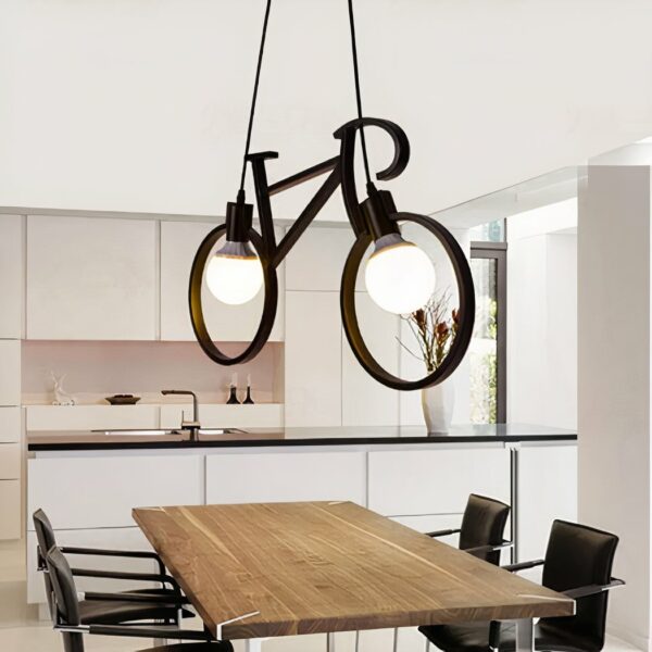 Design wrought-iron chandelier in the shape of a bicycle in a kitchen above a dining table