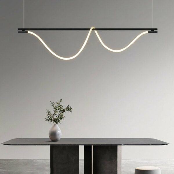 Black steel LED loft pendant above a dining table