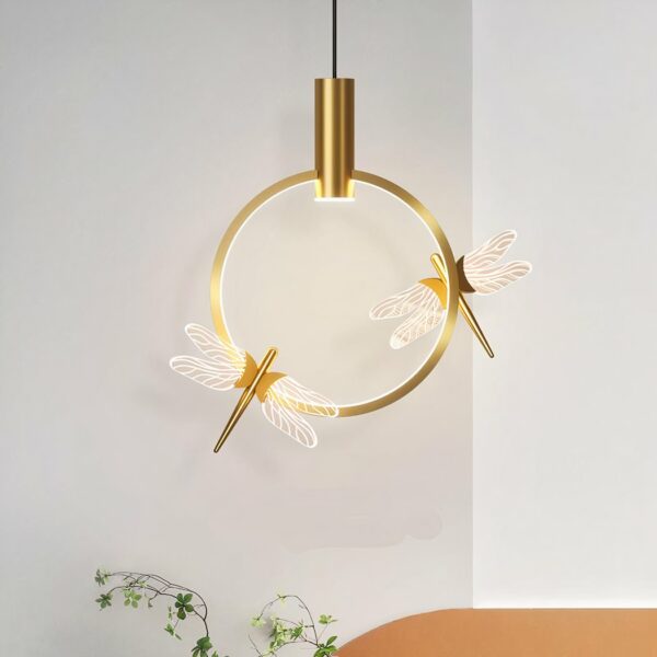 Modern gold dragonfly hanging lamp in a grey living room