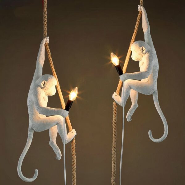 White monkey hanging from a rope presented in two opposing versions