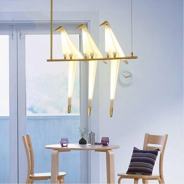 Origami hanging lamp in the shape of a Nordic design bird in a dining room