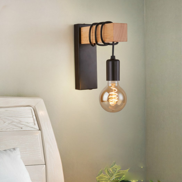 Retro industrial wall light in wood on a grey background