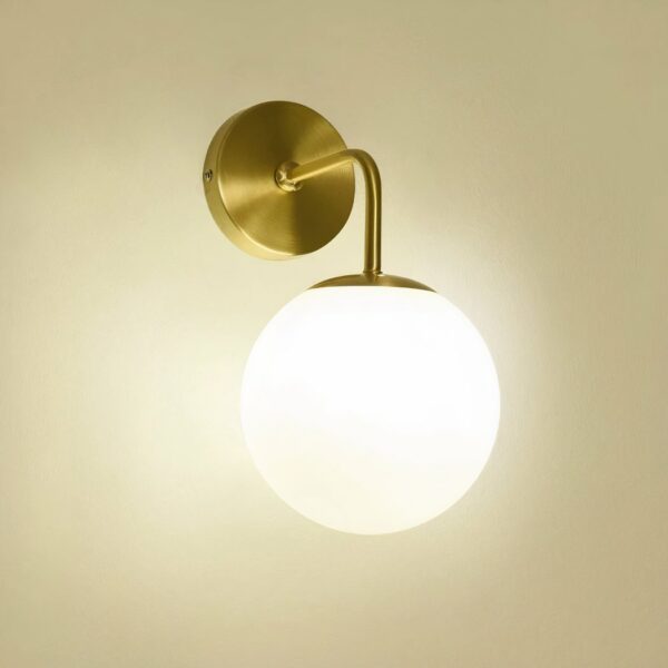 Round wall light in glass and gold metal