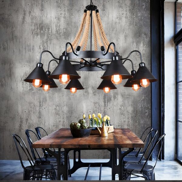 Vintage industrial chandelier in hemp rope and lampshade in a dining room above a dining table