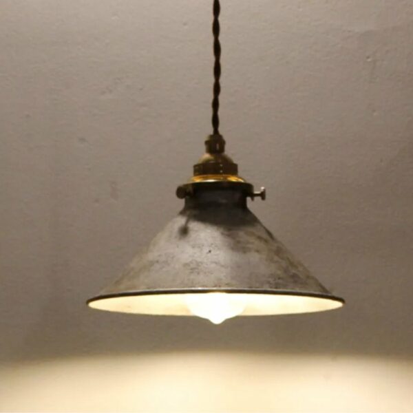 against a dark background, we see a vintage iron suspension in the industrial style