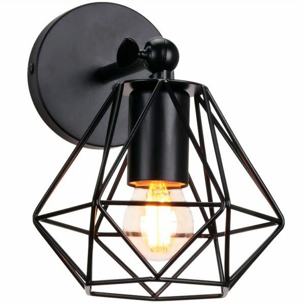 Black iron wall sconce, featuring a round base with a horizontal arm. Suspended from this is a shade in the shape of an origami-style pledge. With lit bulb. White background.