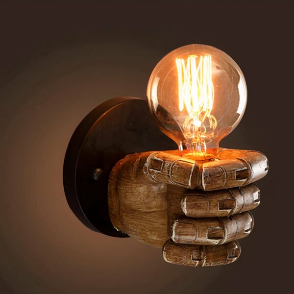 Vintage wall lamp in the shape of a hand on a brown background