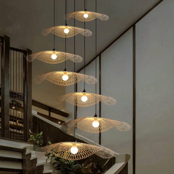 Aerial hanging made of bamboo straw suspended at different heights in an entrance hall.