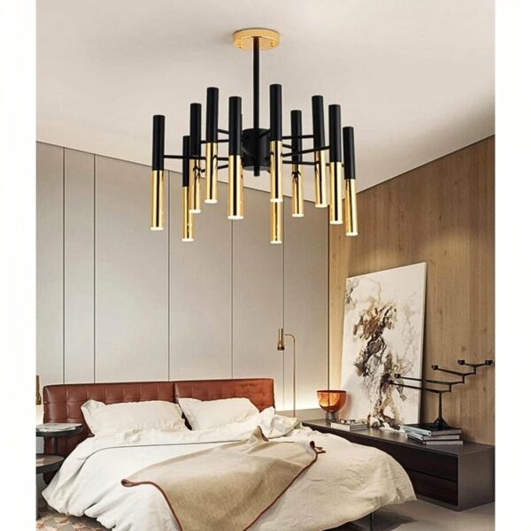 a black and gold multi-headed designer chandelier can be seen in a bedroom