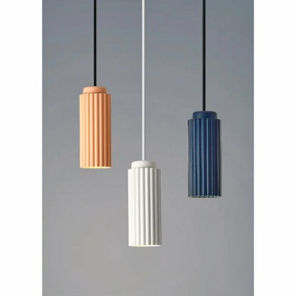 on a light background we see 3 Scandinavian-style pendant lights in different colors: white, pink and duck blue