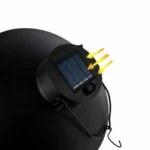 Close-up of the solar panel and hanging hook on top of a black globe lamp