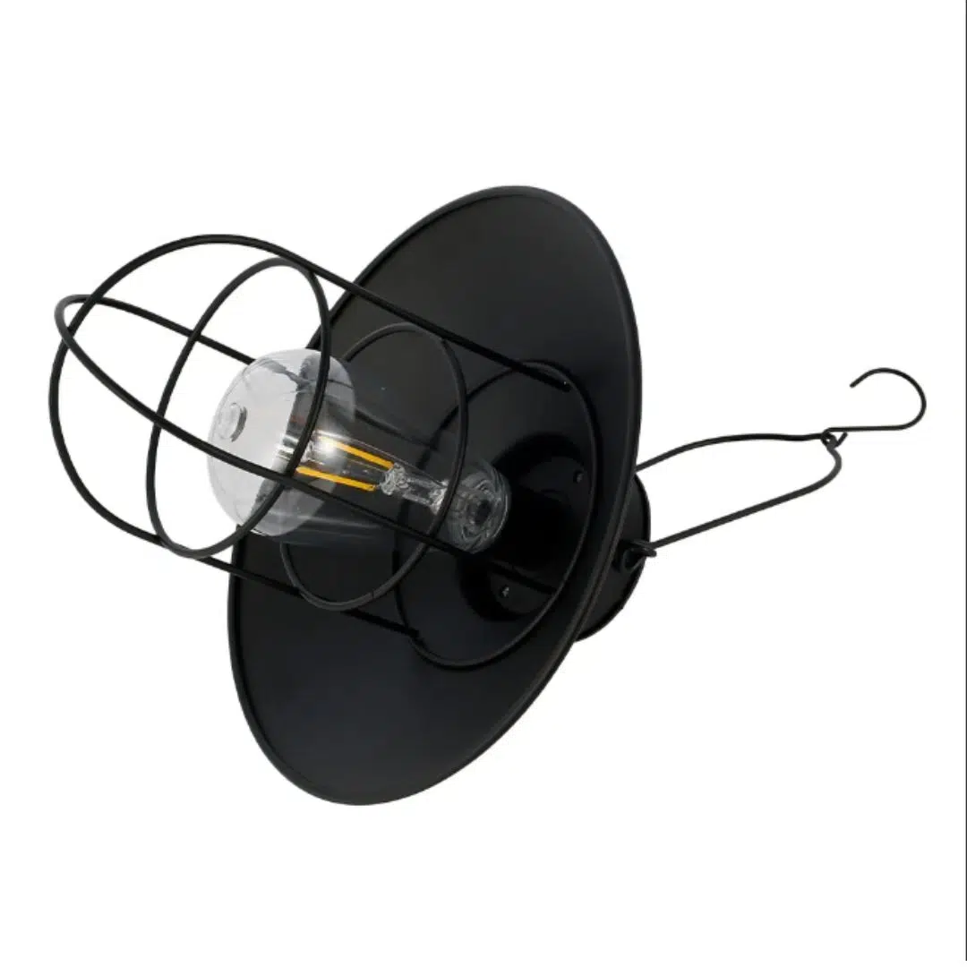 Black cage pendant light on its side showing the bulb, shade and hook