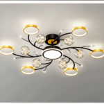Round chandelier with black and gold rings and crystal ball details
