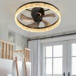 Crystal ring ceiling fan with brown blades above a bunk bed room
