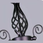 Close-up of the twisted wrought iron scrollwork atop the candelabra-style chandelier