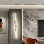Zigzag linear LED wall light on a fluted panel beside a marble accent wall