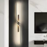 Zigzag linear LED wall light glowing on a dark fluted wall panel