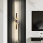 Zigzag linear LED wall light glowing on a fluted black panel wall