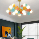 Colourful sphere chandelier in a living room with a dark green wall and horse painting