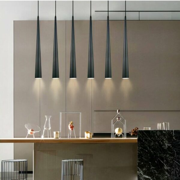 Modern cone-shaped pendant presented several times in a row above a kitchen table