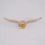 Gold bird-shaped wall light with outstretched wings