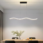 White wave shaped LED pendant above a wood table with black chairs