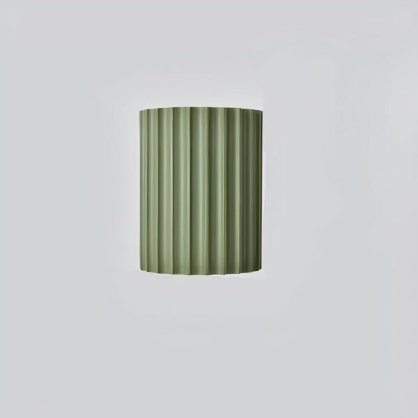 Scandinavian strillée wall light with double white illumination shown installed on a wall above a sofa