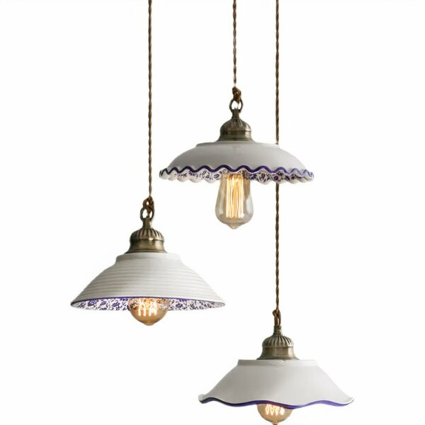White ceramic pendant with a blue print in three variations on a white background.