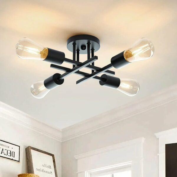 Black metal ceiling chandelier with black rods intersecting in a square with bulbs on one end of each rod White frames on bottom left and door frames on right
