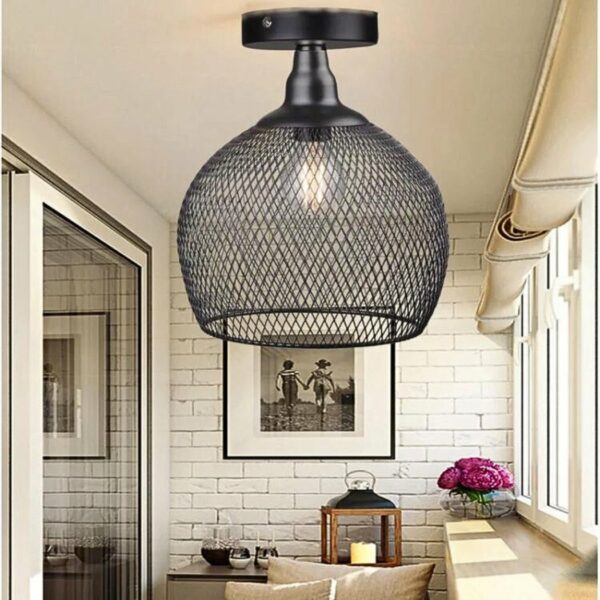 in a light-toned living room, we see a cable-free black suspension in the industrial style