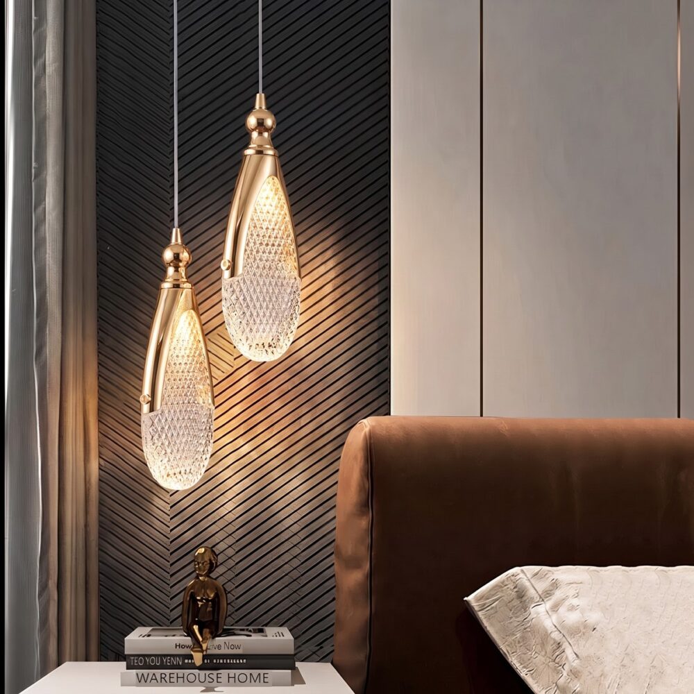 Chandelier with flat diamond-cut acrylic drops and gold frames in a bedroom