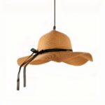 Front view of the woven straw hat pendant light with the black ribbon hanging down