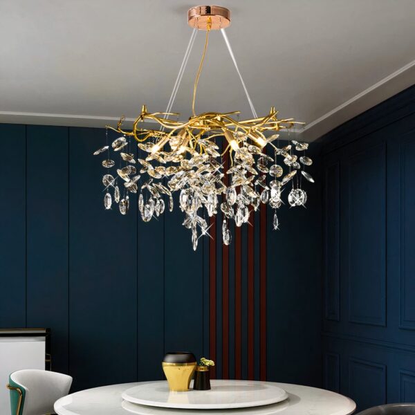 Gold branch chandelier with crystal drops above a dining table