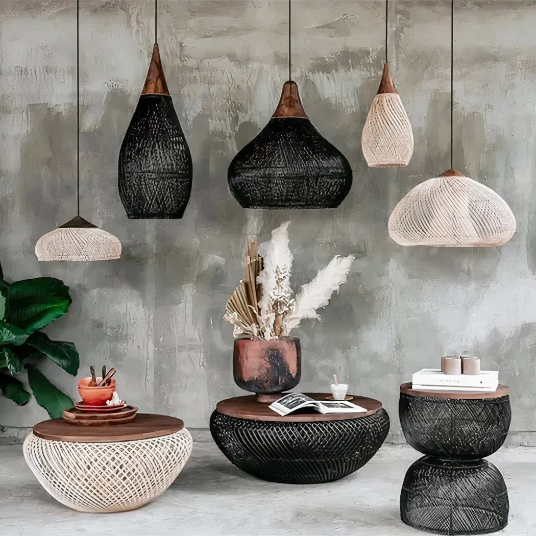 Assortment of hand woven bamboo pendant lampshades in various shapes on a wall
