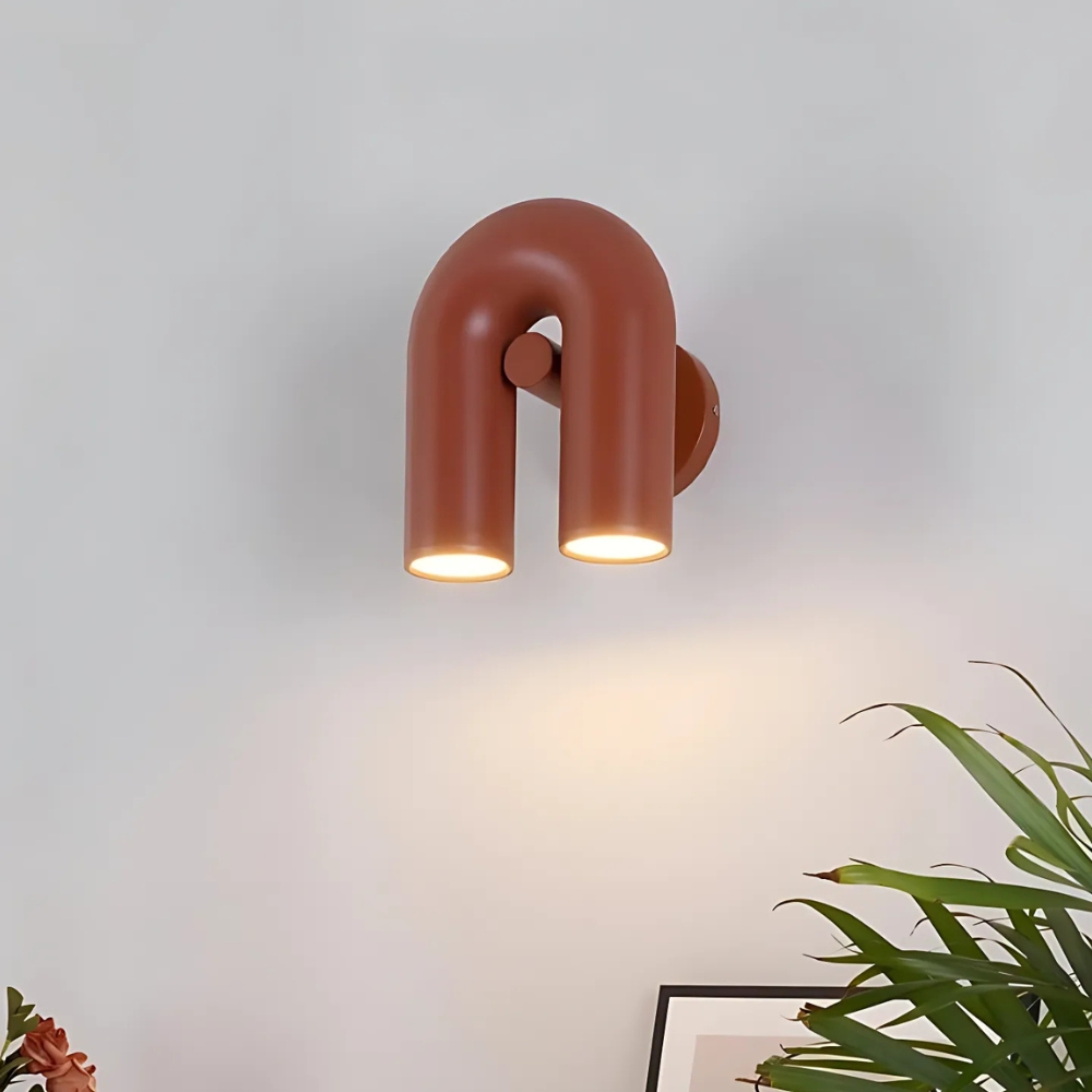 Terracotta U-shaped wall light with two downward facing spotlights