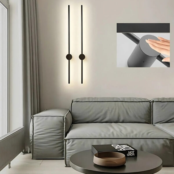 Two vertical black LED light tubes joined by a round wall disc