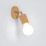 Wooden wall light with a round base and a lit bare bulb