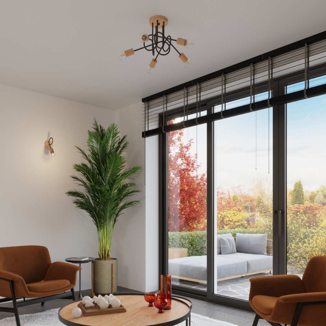 Wooden ceiling chandelier above a living room with bamboo blinds and rattan chairs
