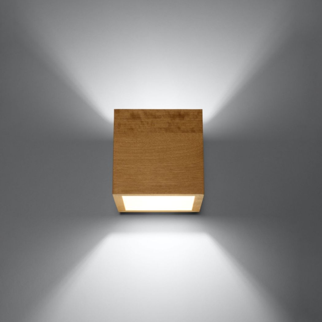 Cube shaped wooden wall light lit with light beams up and down