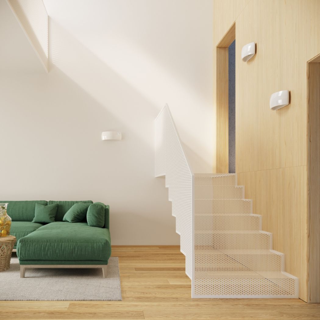 White half moon wall light on a wood clad stairwell wall above a green sofa
