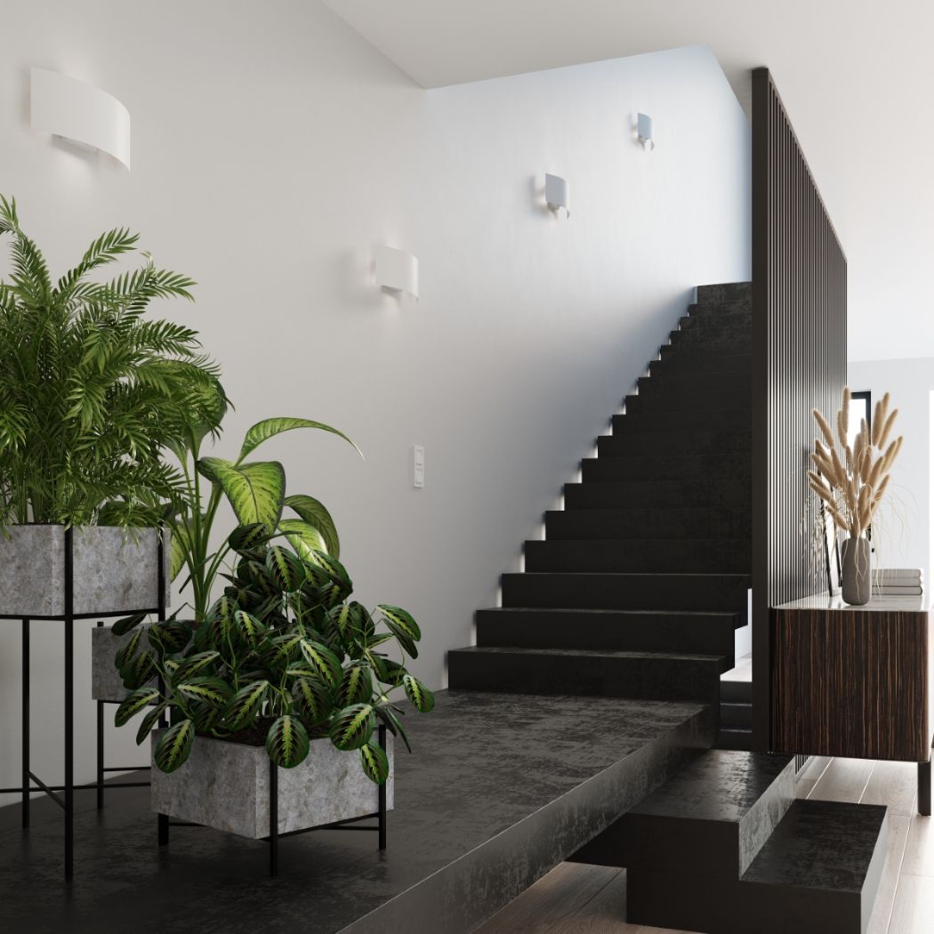 Staircase with several white curved wall lights and potted plants