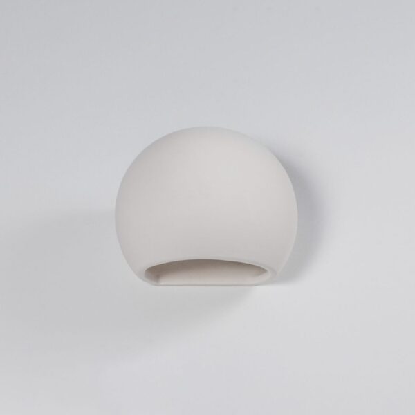 White ceramic dome-shaped wall light with a flat cut base