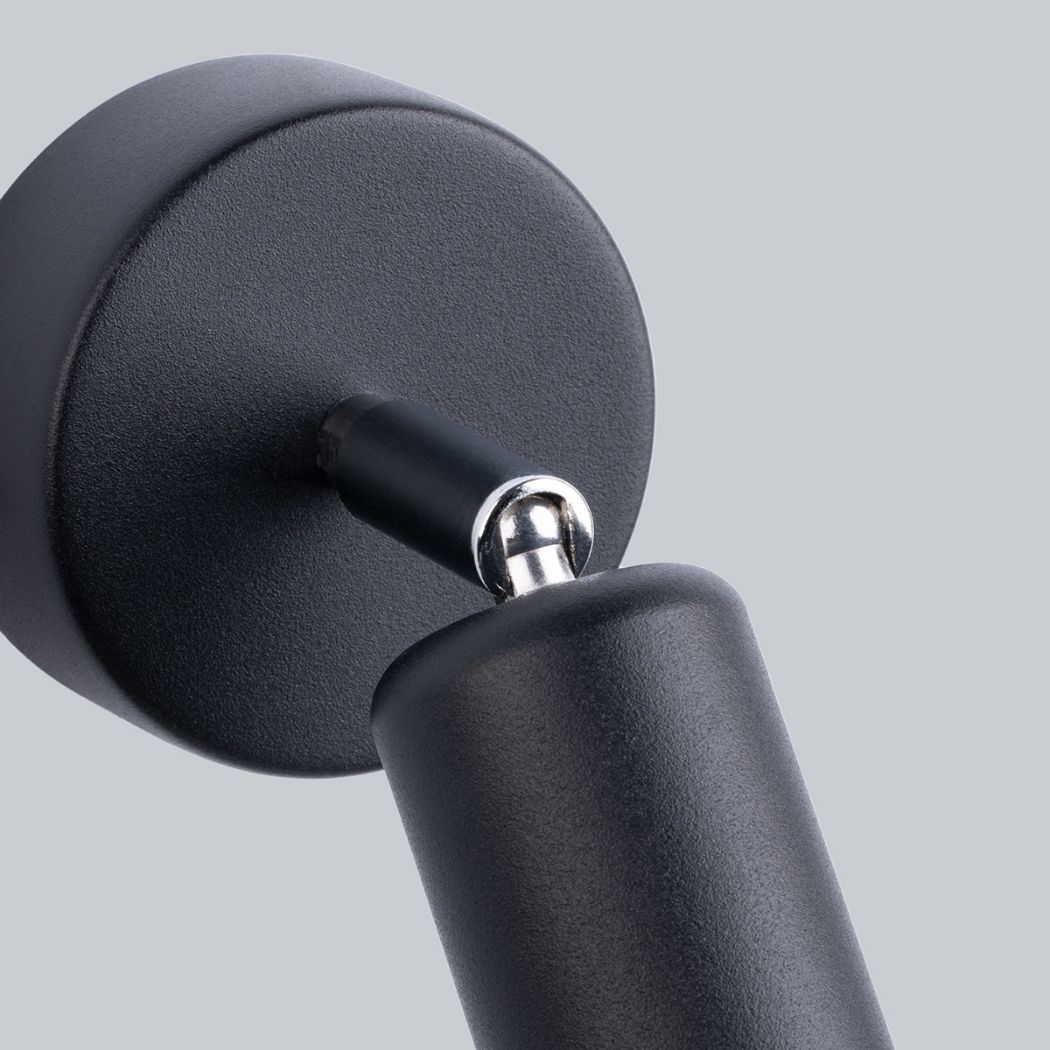 Close-up of the ball joint hinge on the black adjustable wall spotlight