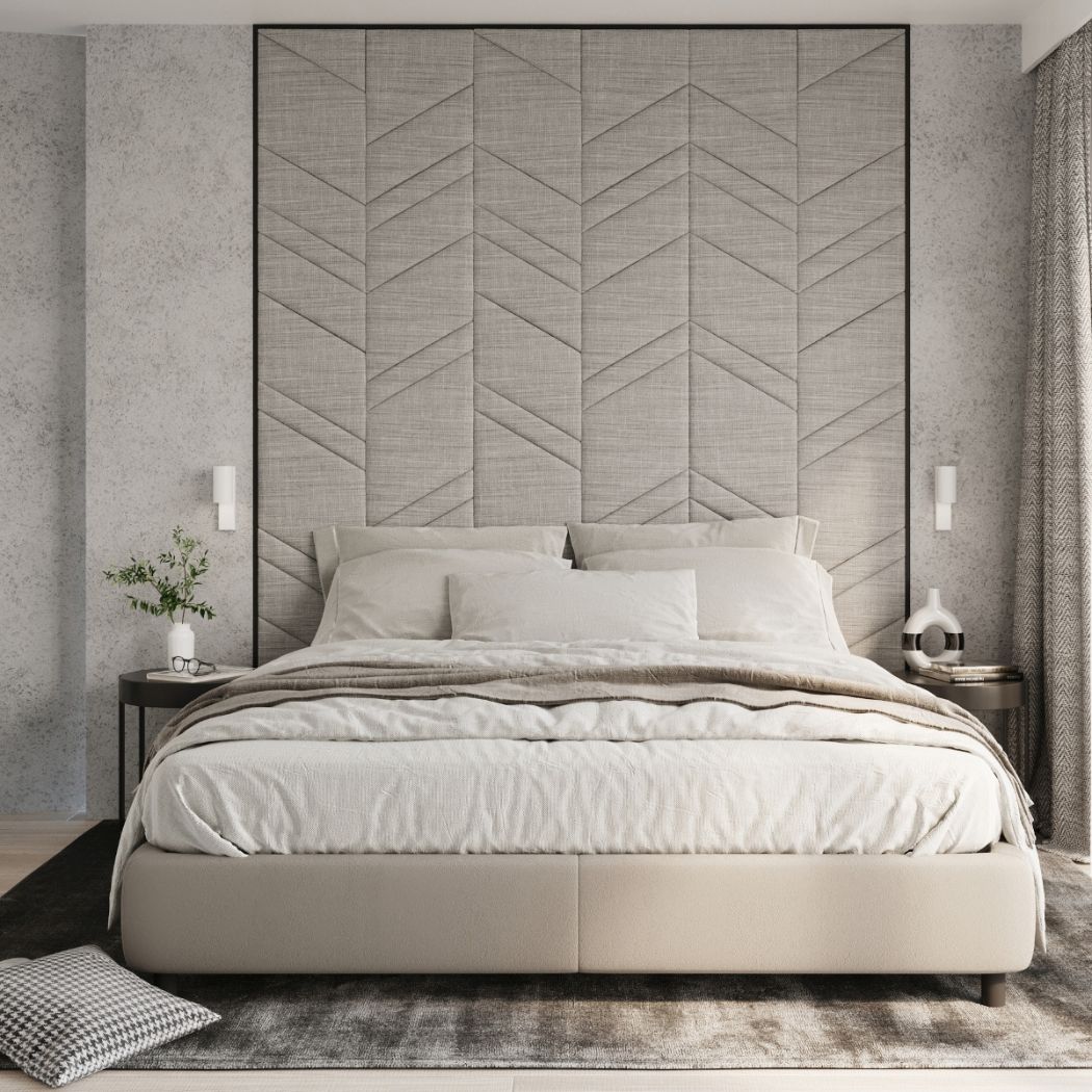 Bedroom with a chevron-patterned headboard wall and two white wall lights