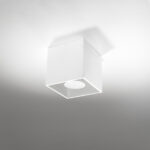 White square ceiling light mounted in a corner with a round spotlight face