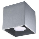 Close-up of the silver cube-shaped surface-mounted spotlight on a white background