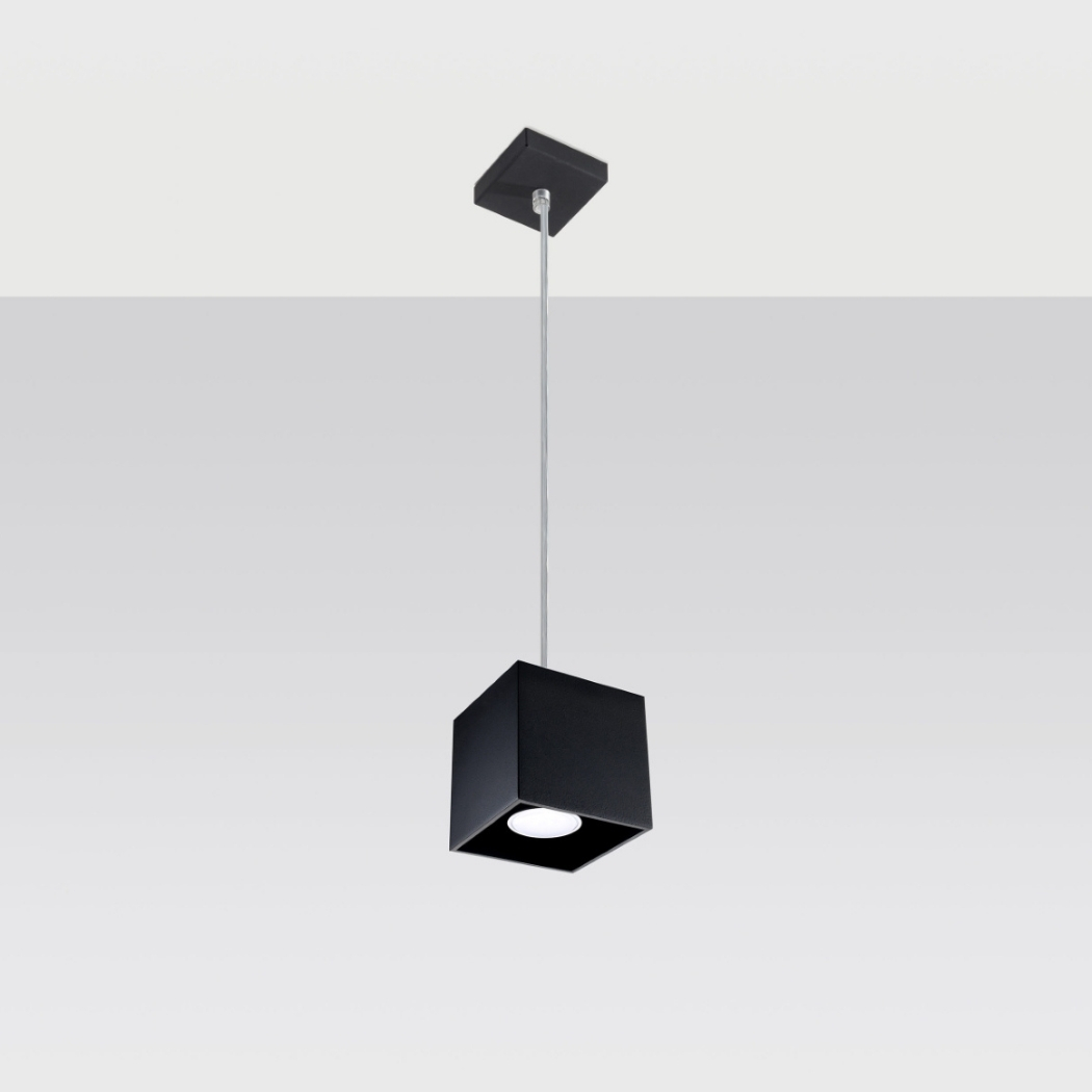 Black cube pendant light with a round light source at its base