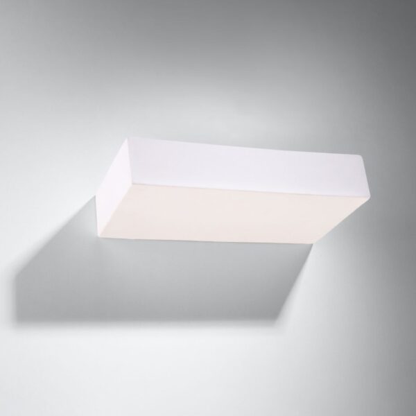 Rectangular block shaped white ceramic wall light with a sculpted underside