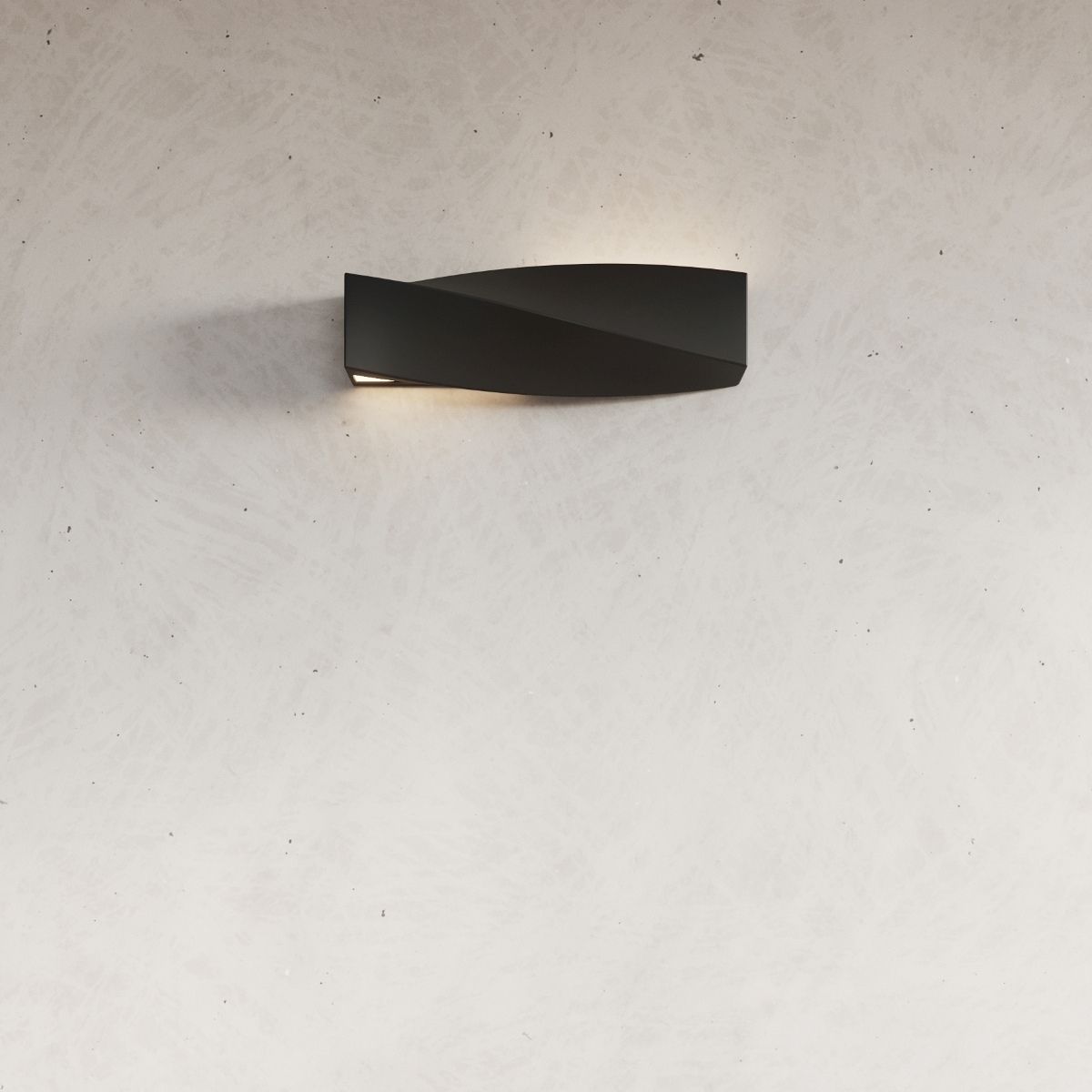 Angular black wall light mounted on a textured plaster wall