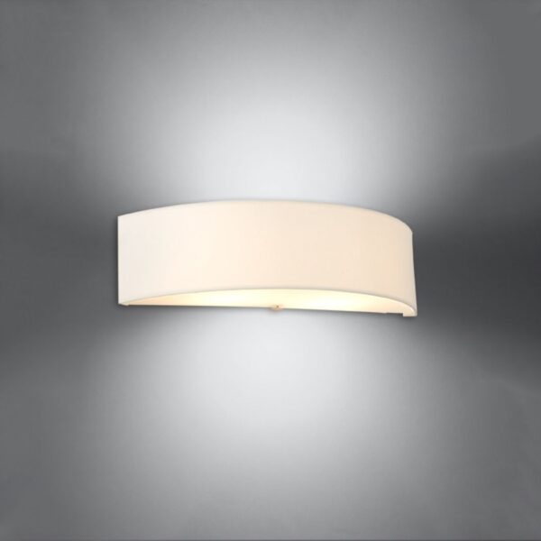 Curved white half-moon wall light glowing with soft diffused light